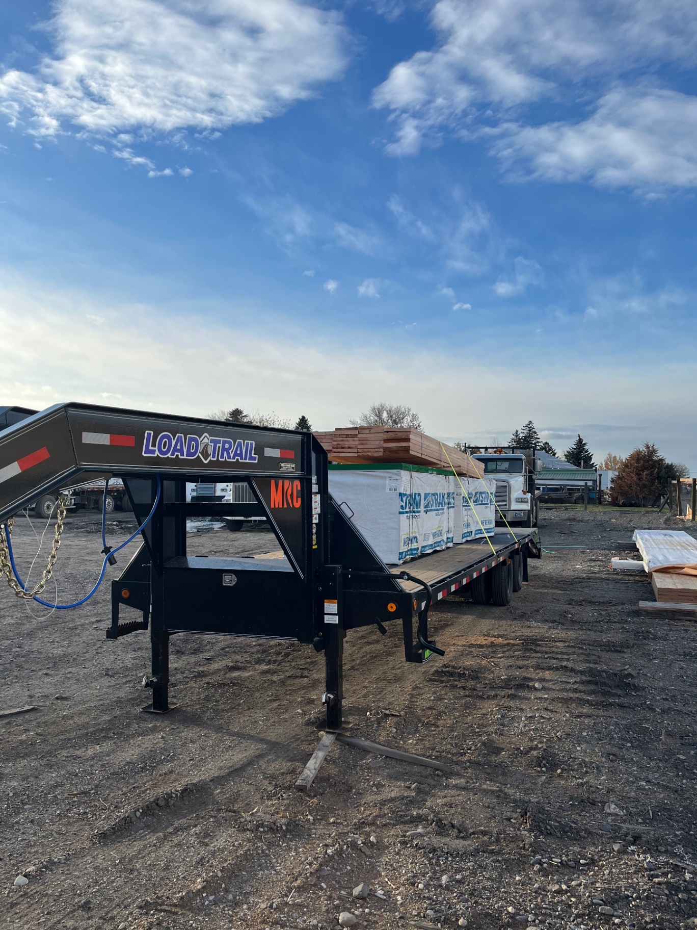 30-foot gooseneck flatbed trailer loaded for delivery