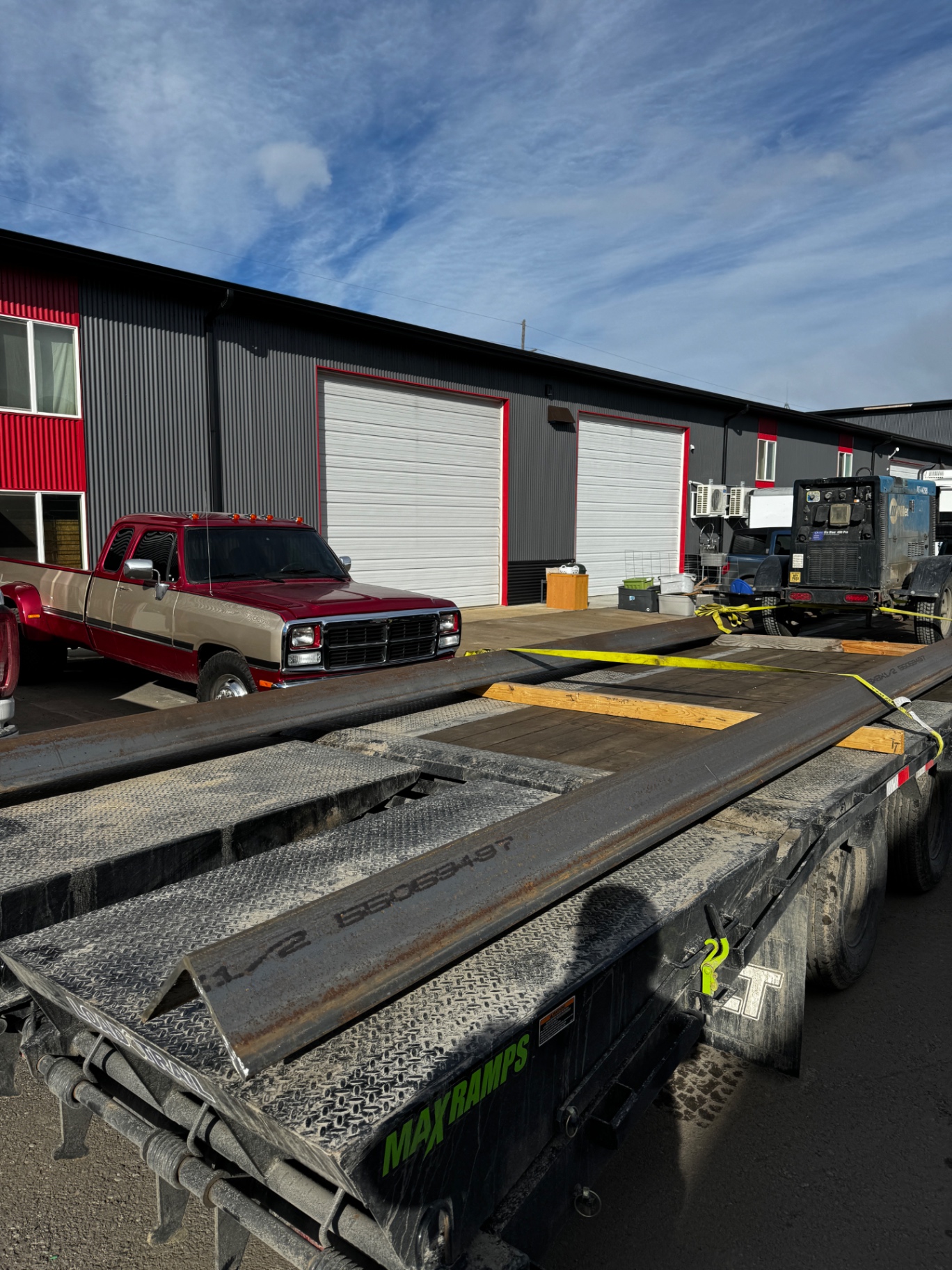 Steel beams strapped down on a flatbed trailer