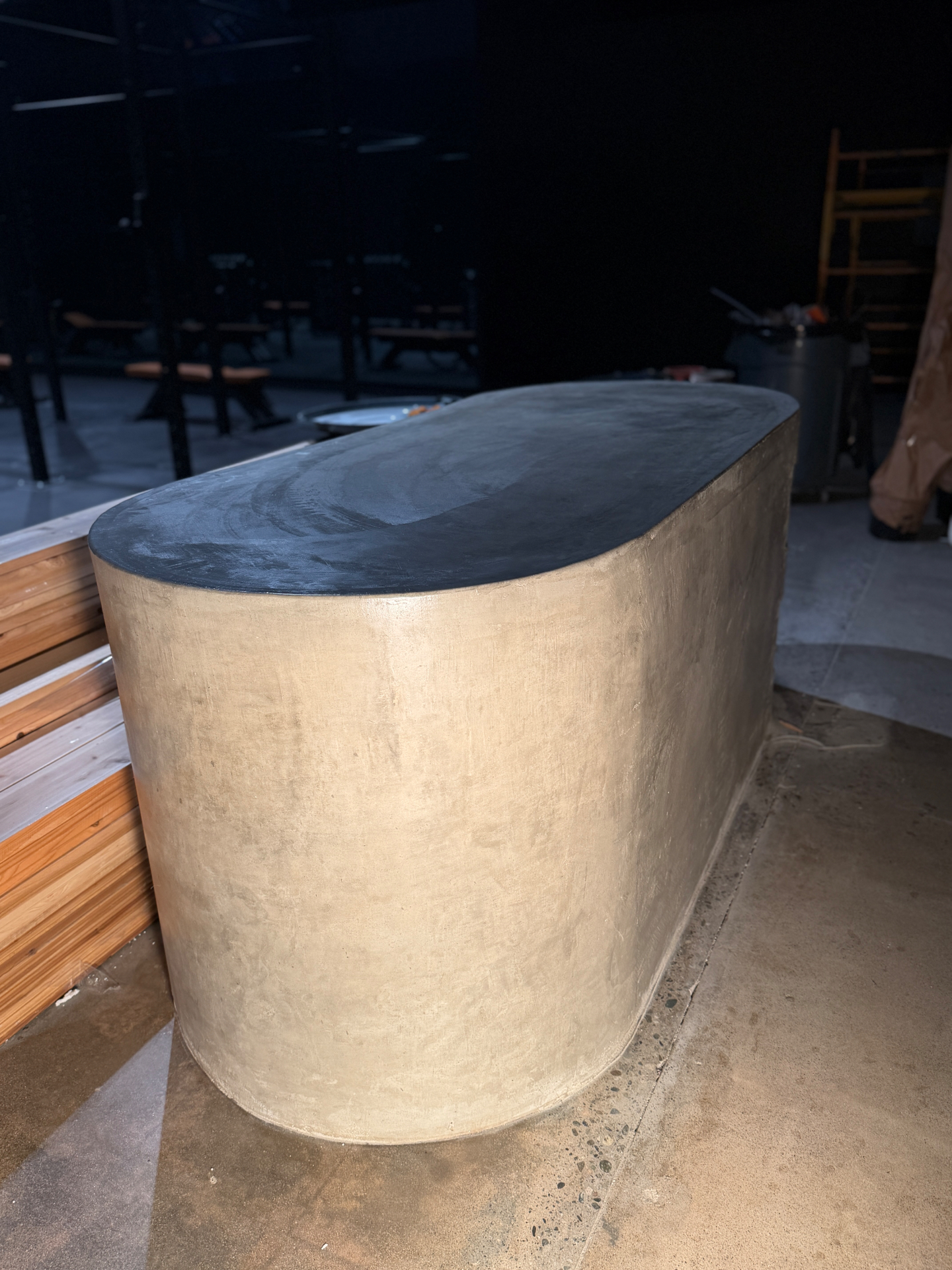 Gold and black micro-concrete bar bench at The Yard Gym, designed by Tiarne and Dan Bova, fabricated by Driftwood