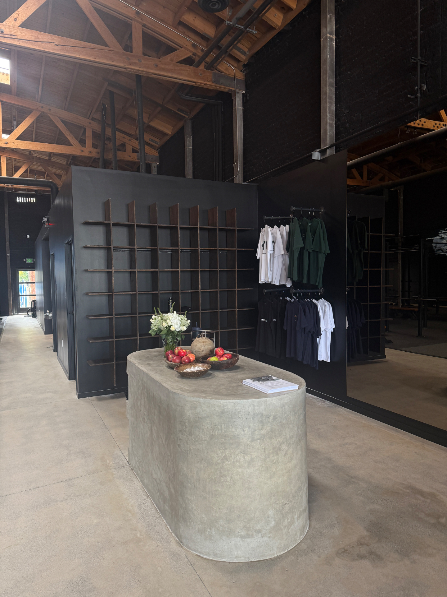 Sculptural concrete retail counter at The Yard Gym, designed by Tiarne and Dan Bova, fabricated by Driftwood